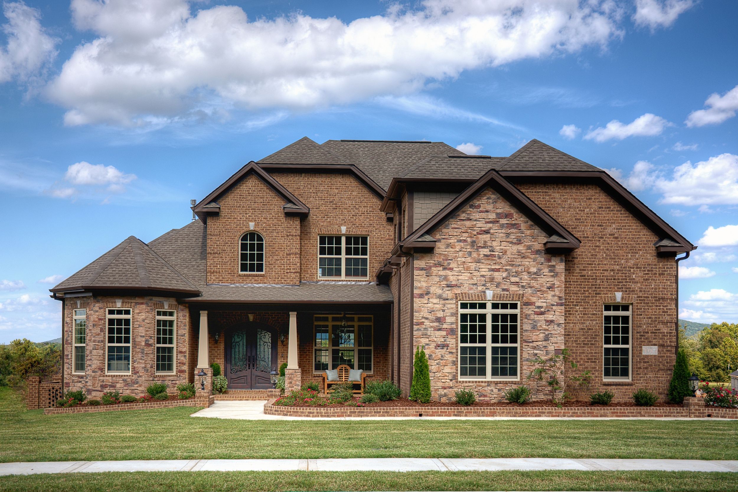 A brick home in Huntsville, Alabama on a sunny day
